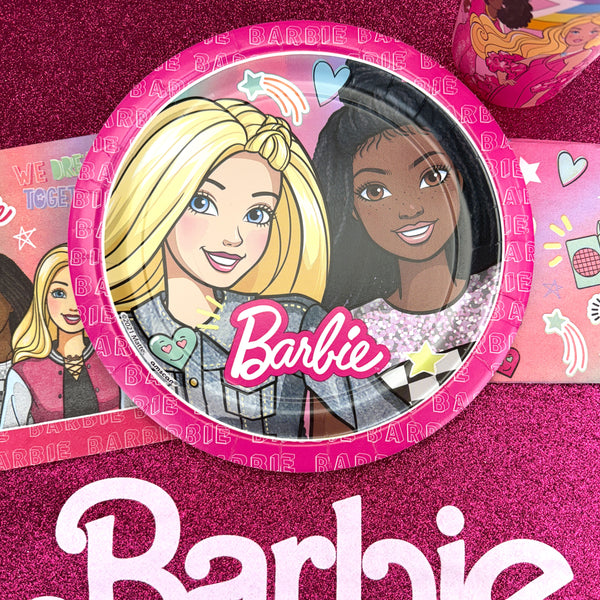 Add a bold pop of personality to your party table with these 9" Barbie paper dinner plates! Featuring vibrant artwork of Barbie and a friend smiling brightly against a pink background with playful doodles like stars, hearts, and rainbows, these plates celebrate friendship, confidence, and creativity. The bold Barbie logo and glitter-effect graphics add extra sparkle, making them perfect for birthdays, sleepovers, or any celebration filled with style and fun. Durable and eye-catching, these plates are great