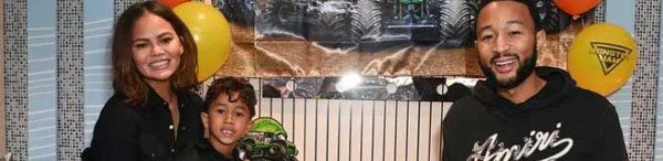 John Legend and Chrissy Teigen celebrating their son's 6th birthday in a Monster Jam-themed suite at the World Finals at SoFi Stadium
