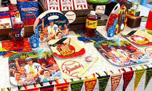Sandlot birthday party table setting with The Sandlot character plates, L7 drink bottles, popcorn boxes, Top Dog trophy, and a baseball pennant banner runner.
