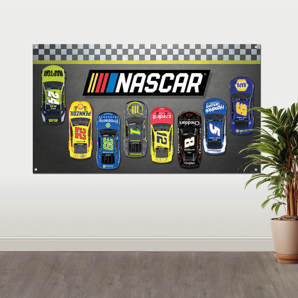 The NASCAR Fabric wall banner by Prime Party, hanging on a wall with a plant in the foreground
