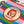 Colorful fabric with a circular patch featuring a character's face and text on a striped background.