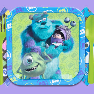 Monster Inc. themed party supplies featuring character plates, and napkins. The tableware showcases Mike Wazowski, Sully, Boo and George Sanderson, with green plastic fork and spoon on a lavender background.