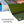 Roll of green vinyl with grommeted corners on a white background.  Vinyl banner with reinforced grommeted corner for easy hanging and secure display.