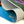 Close-up of a rolled-up poster with colorful design,  Close-up of thick, durable vinyl banner material showing flexible rolled edge and smooth printed surface.