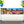 Sandlot-themed birthday banner with a group of boys standing by a fence and a dog peeking over, featuring the text “Happy 10th Birthday, You’re Killin’ Me, Smalls!” displayed on a wall with colorful balloons on both sides.